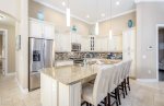 Open Kitchen with Island and Stainless Steele Appliances